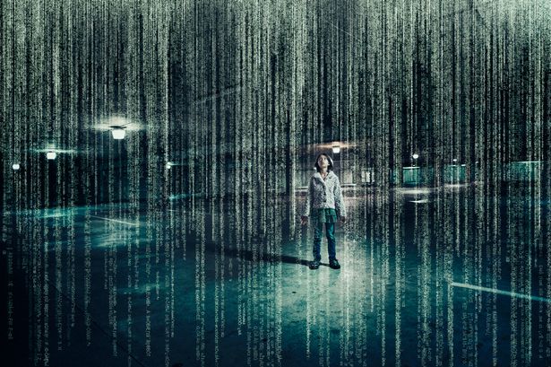 PROD Mixed race girl standing in parking lot under raining binary code