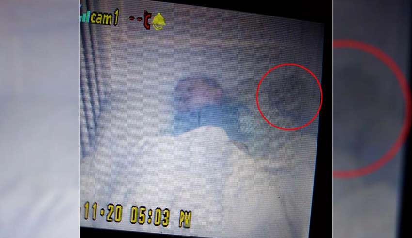 Horrified mother discovering a ghost baby in the crib with her 18-month old son