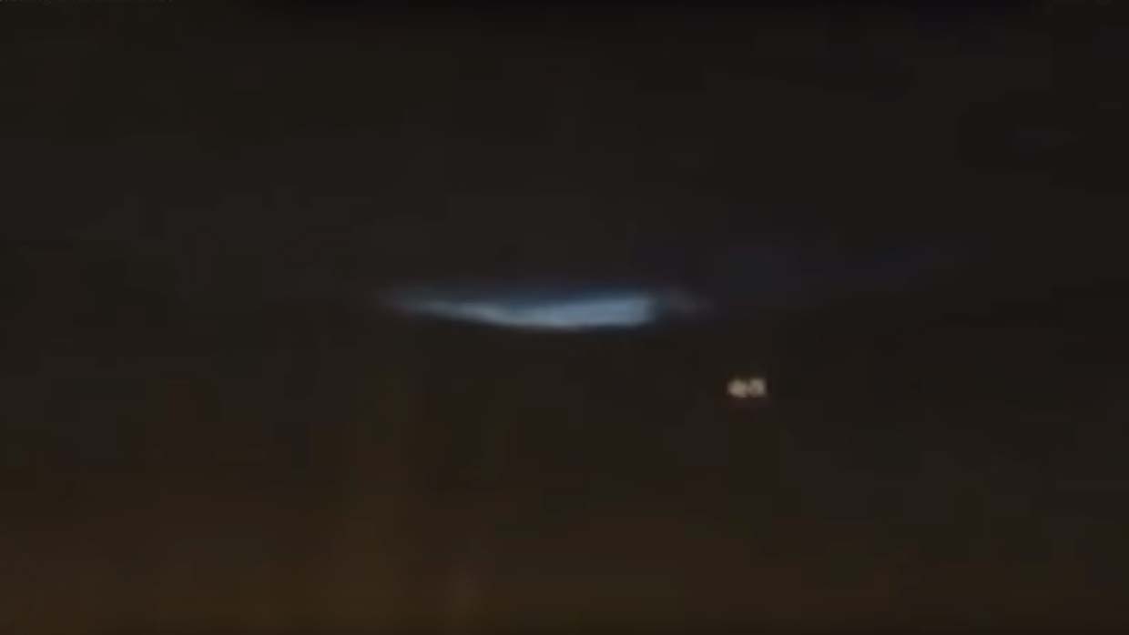 They record an interdimensional portal opening in the Scottish sky