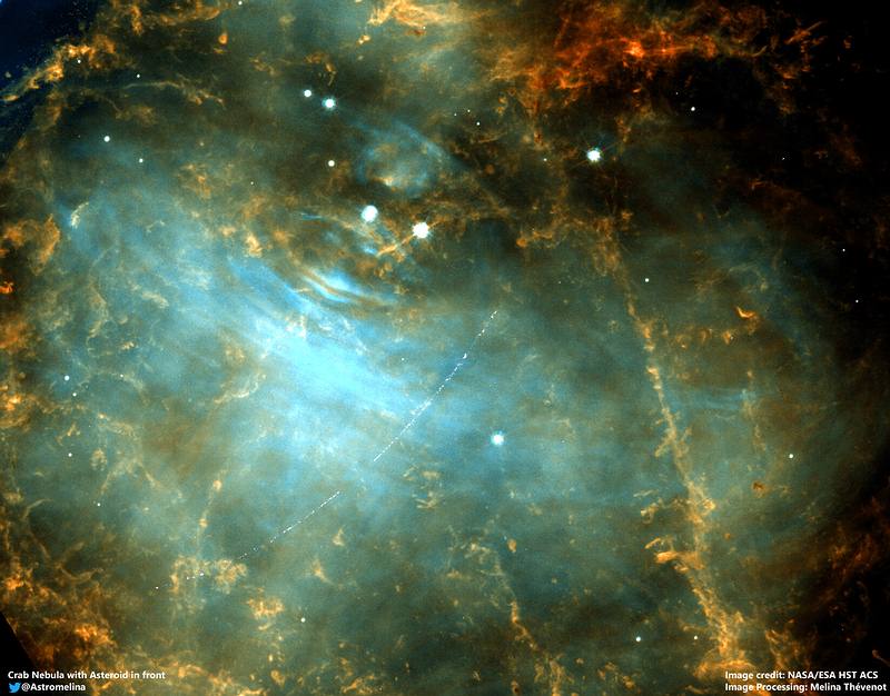 Cosmic Scratch: This Hubble photo shows an asteroid crossing the Crab Nebula