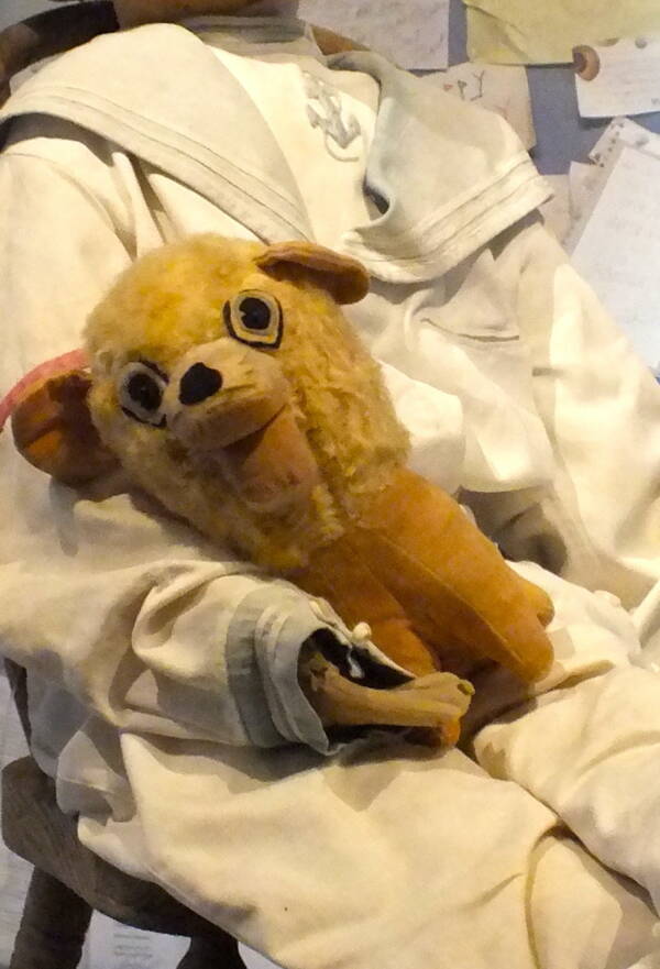 The Toy Dog That Rested On The Doll's Lap