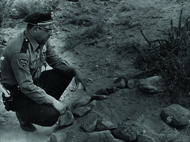 Lonnie Zamora next to the apparent UFO landing site in Socorro