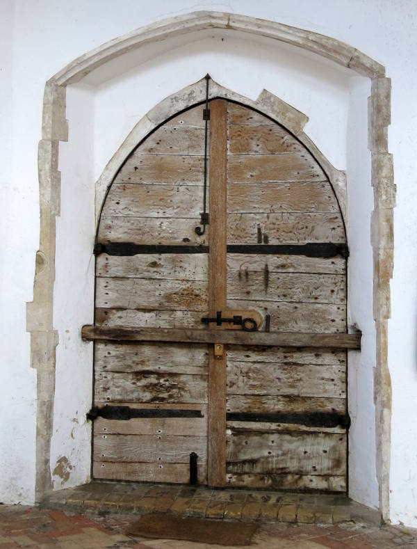 The Legend Of Black Shuck- The Hellhound That Terrorized England During Harsh Winters 4 The inside of the door of Holy Trinity Church in Blythburgh. some say those scorch marks were left by a devil dog.